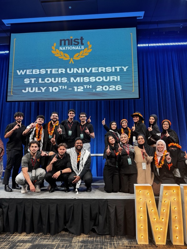 Team on stage with MIST Nationals banner