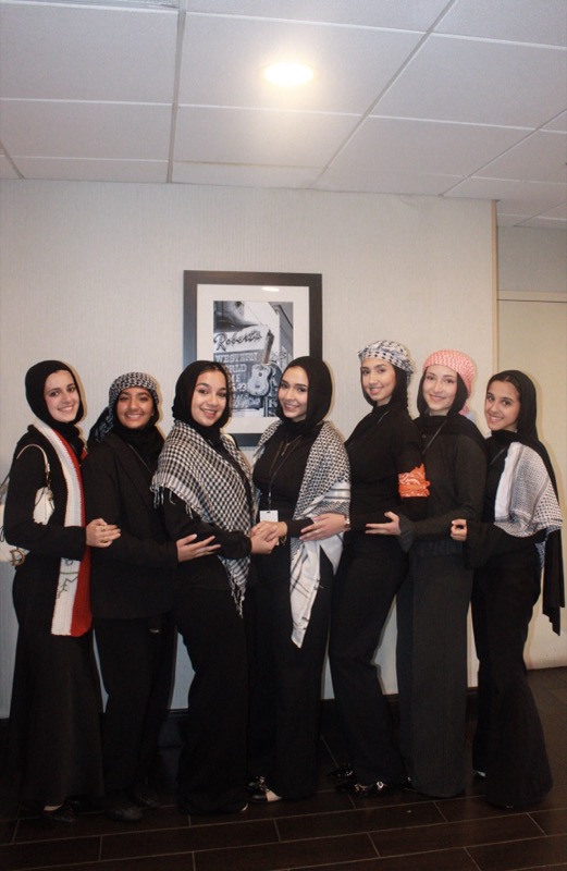 Girls posing in matching outfits