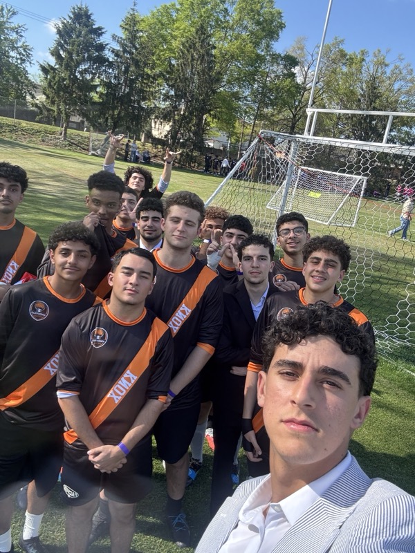 Soccer team selfie on field
